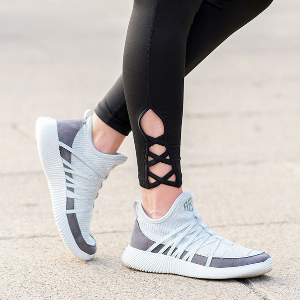 athleisure leggings and monogrammed sneakers