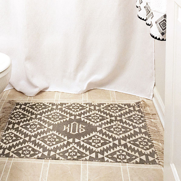 personalized grey mat in front of shower