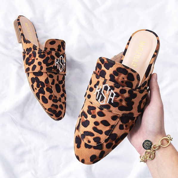 leopard spots slide on loafers in hands