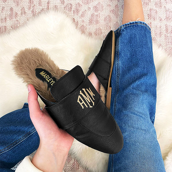 Fur lined black loafers with rug