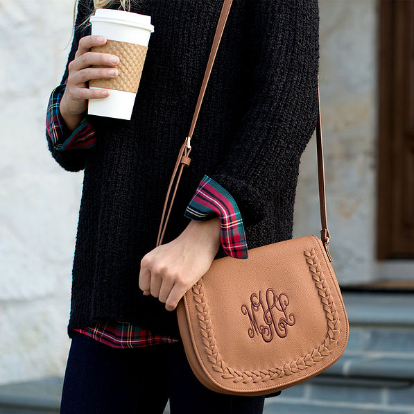 monogrammed crossbody with black sweater and coffee