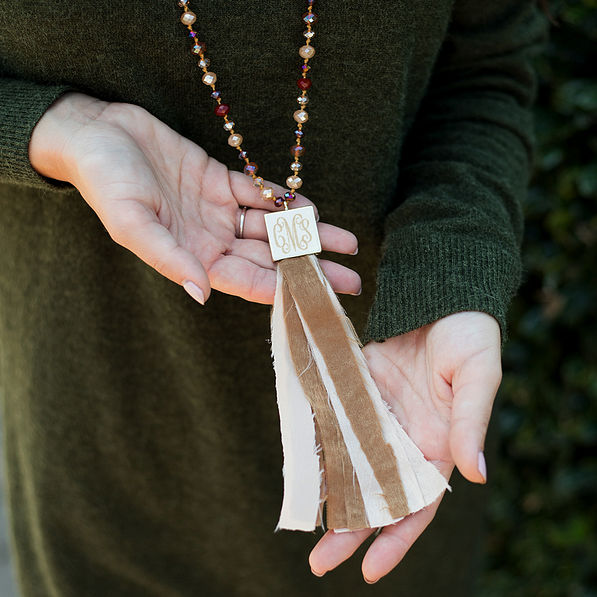 fabric tassel necklace with monogrammed pendant