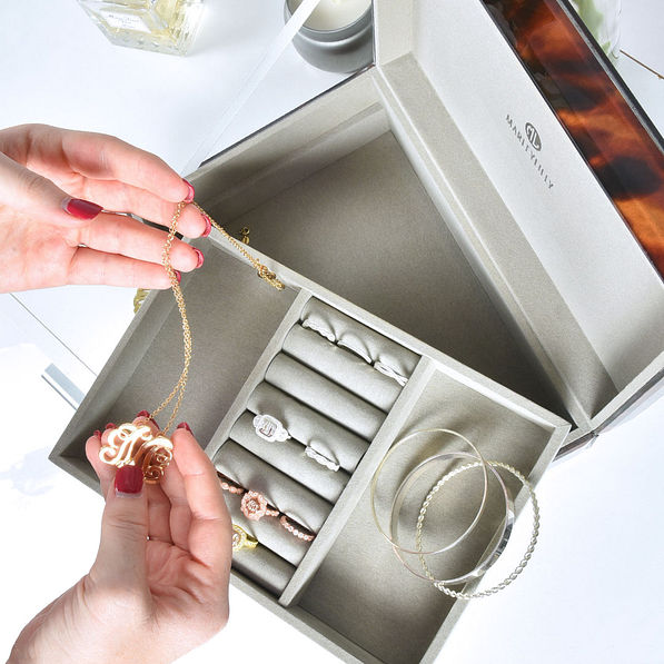 jewelry box with monogrammed necklaces and rings