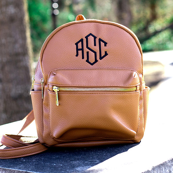 monogrammed faux leather backpack with zipper front pocket