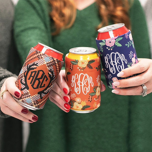 3 girls holding cans of drinks with monogrammed koolies