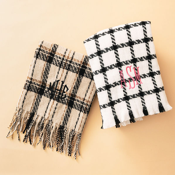black and white and tan plaid scarves flatlay