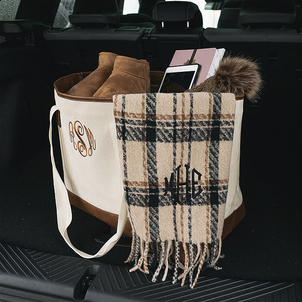 tan plaid scarf in car trunk