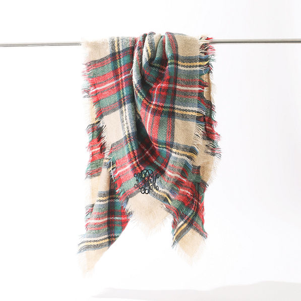 monogrammed camel plaid scarf on rack