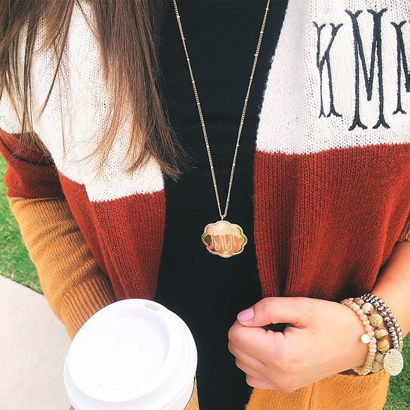 gold monogrammed scallop necklace with colorblock cardigan