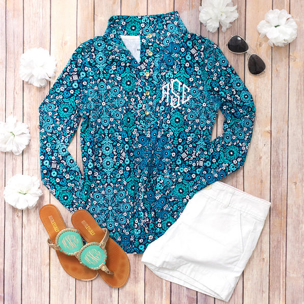 printed pullover with white shorts and embroidered sandals