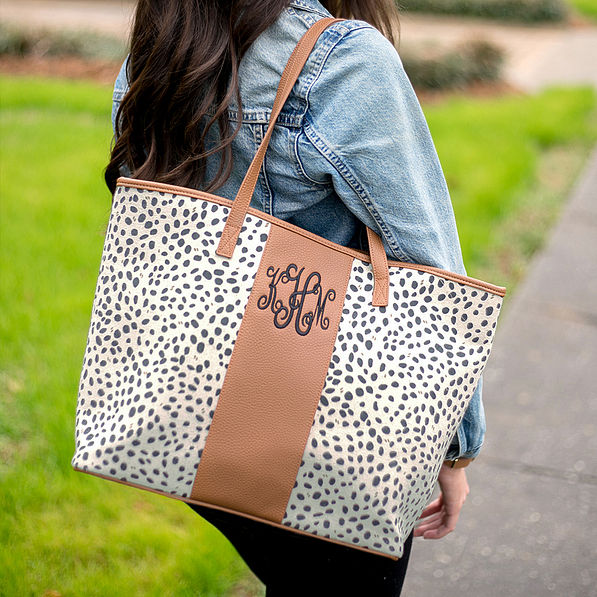 girl wearing monogrammed leopard tote on shoulder