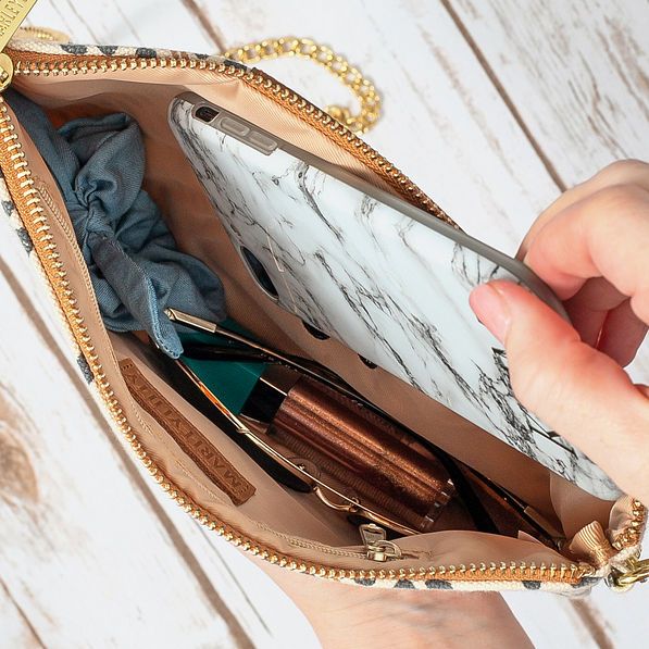 inside of monogrammed leopard clutch with zipper pocket
