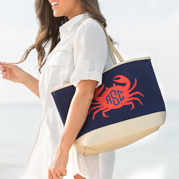 monogrammed sparkly crab beach bag on girl's shoulder