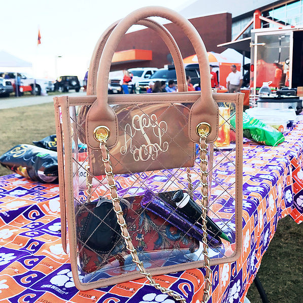 monogrammed clear tote on tailgate table at football game