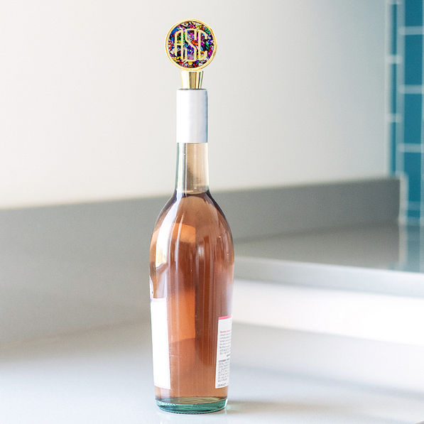 monogrammed confetti wine stopper inside wine bottle