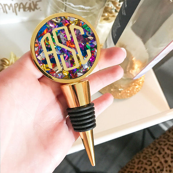 colorful confetti monogrammed wine stopper near bar cart