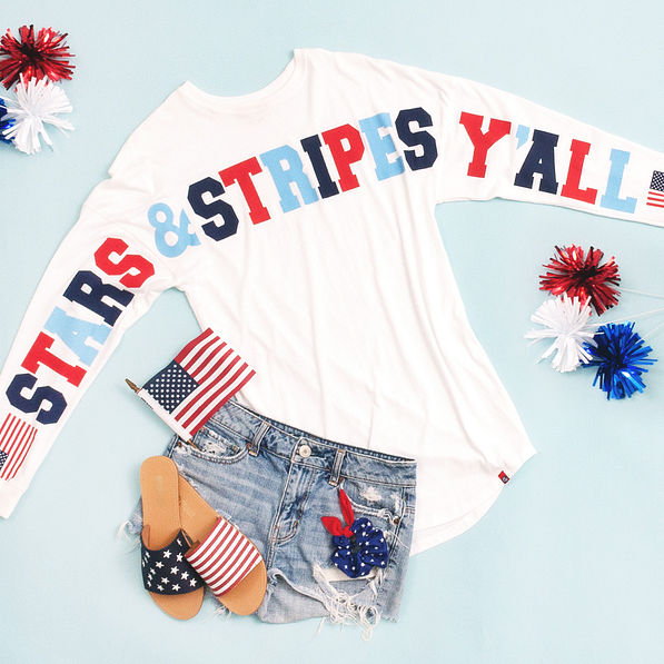 stars and stripes jersey with jean shorts and slide sandals