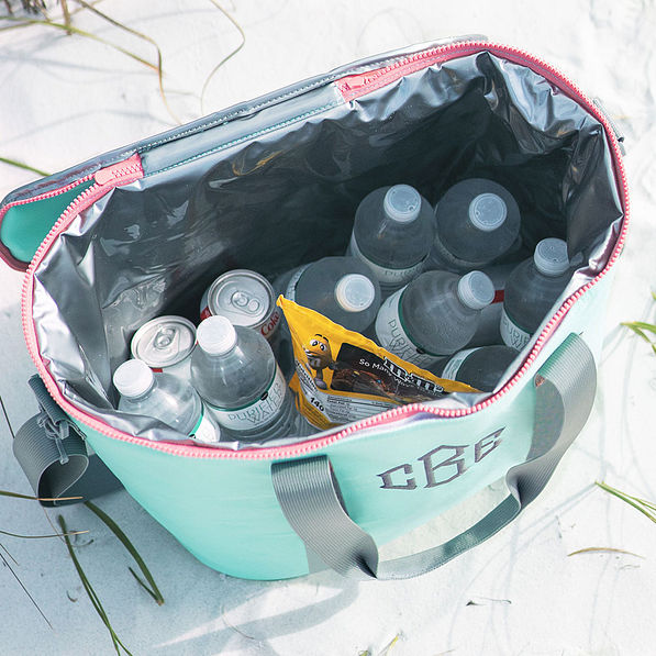 inside of monogrammed mint cooler with water bottles and food