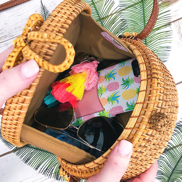 inside hard round straw bag with loop closure