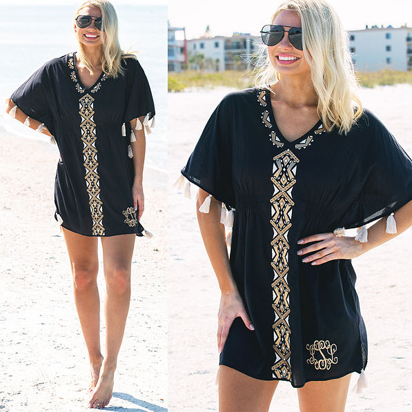 blonde in monogrammed black tassel coverup at the beach
