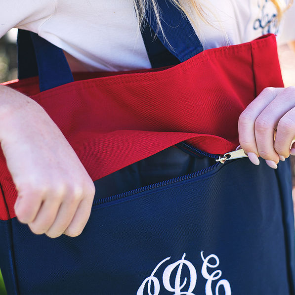red and navy monogrammed tote with concealed zipper compartment