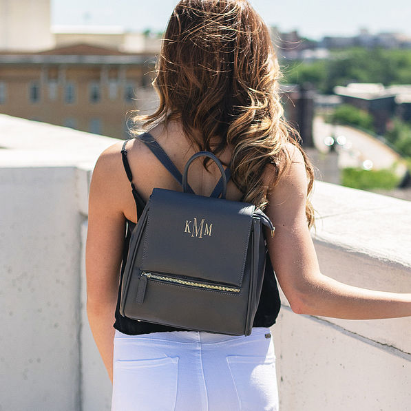 girl on rooftop wearing monogrammed mini charcoal backpack