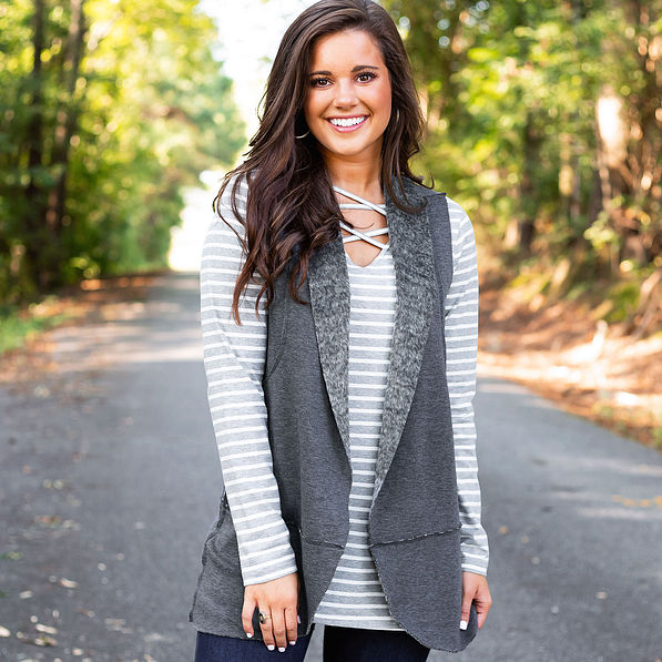 reversible gray vest with sherpa side paired with gray and white striped two way tunic