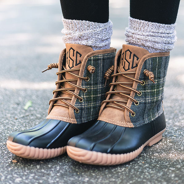 charcoal plaid and black monogrammed duck boots with leggings and duck boot socks on pavement