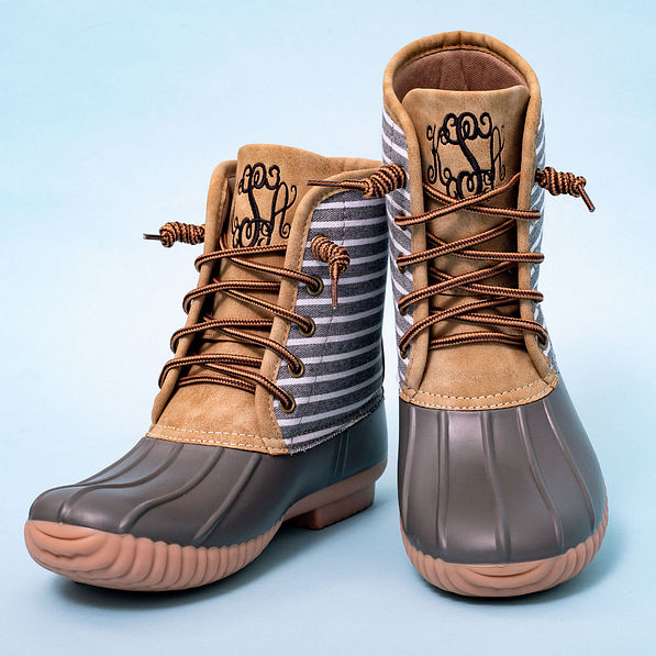 gray striped duck boots with blue background