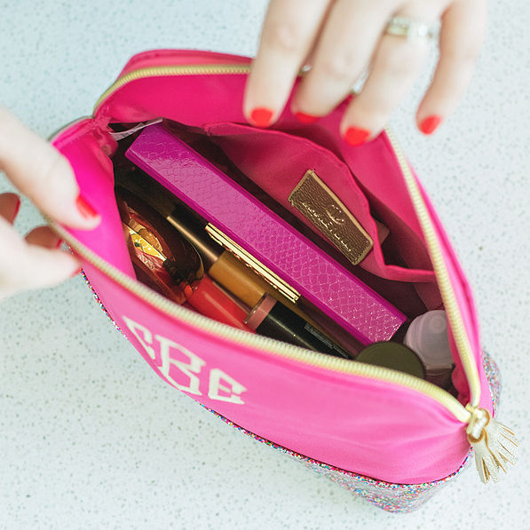 inside monogrammed hot pink confetti cosmetic case with makeup