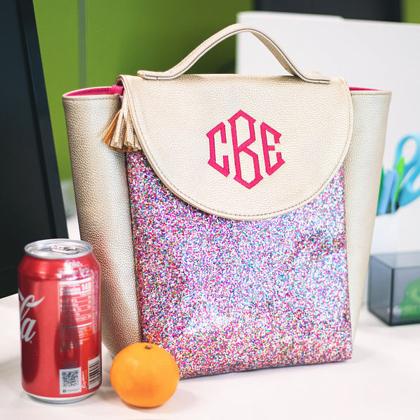 confetti lunch bag on desk with drink and orange