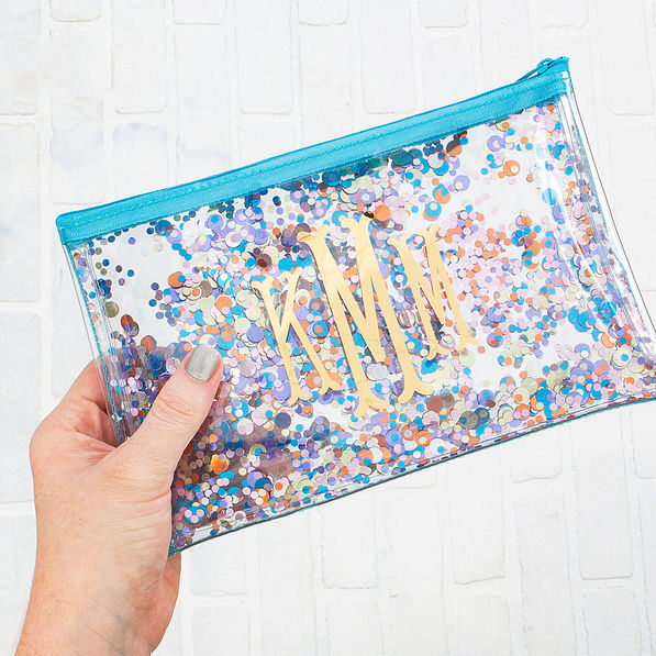 floating glitter pouch with brick backgrounf