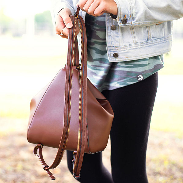 unzipping covertible mini backpack