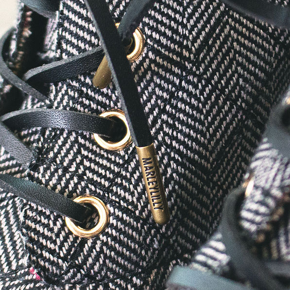 branding on end of black suede shoelaces