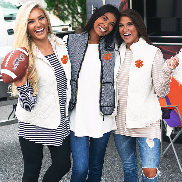 girls at clemson tailgate wearing cute clemson vests