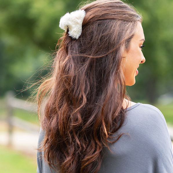 white sherpa fur hair clip in hair