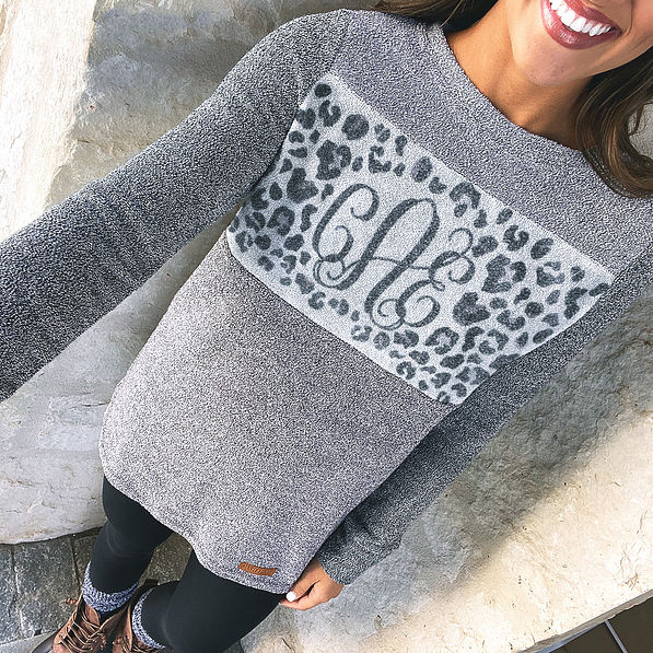 selfie of monogrammed leopard colorblock pullover