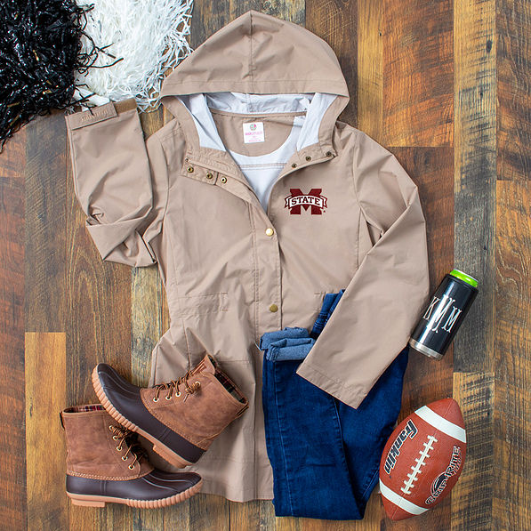 Mississippi State Khaki rain jacket with wood background
