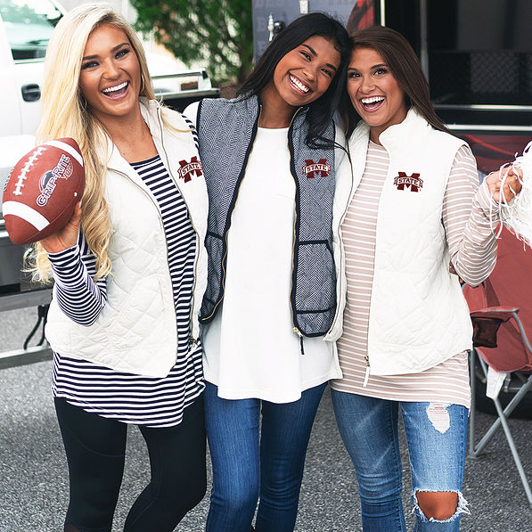 girls at tailgate in mississippi state gameday gear