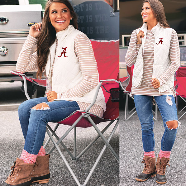 side and front view of alabama puffy vest with jeans and duck boots