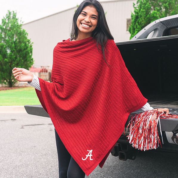 crimson poncho with alabama logo at tailgate