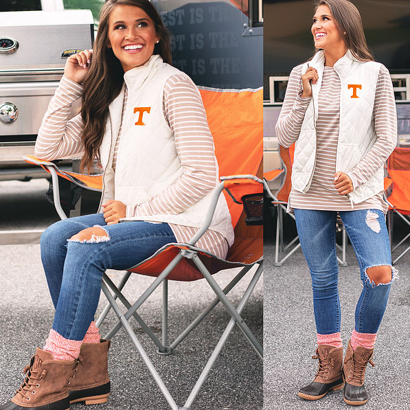 side and front views of tennessee puffy vest with jeans and duck boots