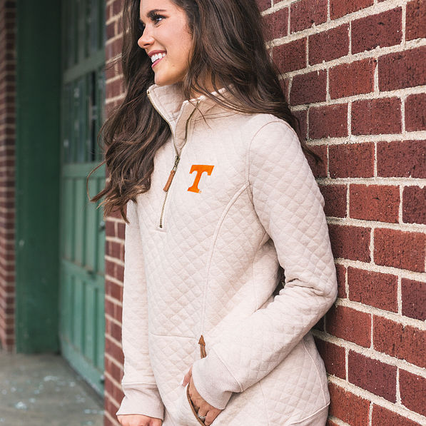 tennessee quilted pullover sweatshirt against brick wall