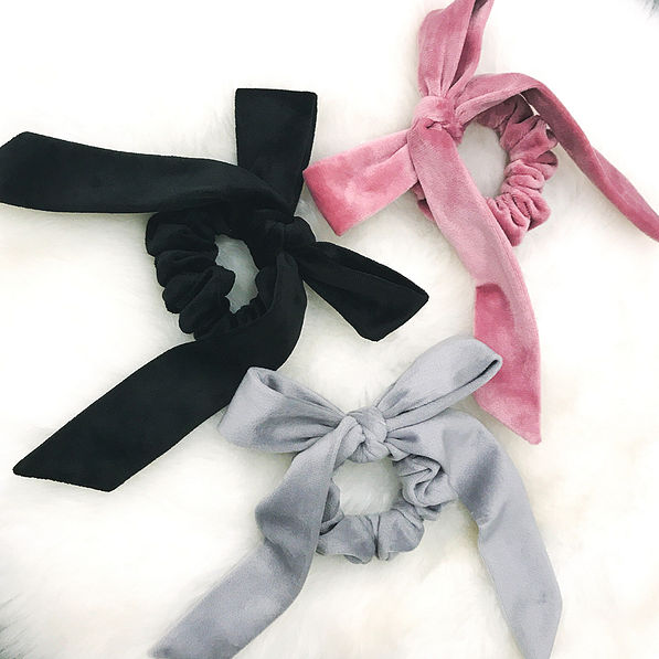 velvet bow scrunchies on faux fur rug