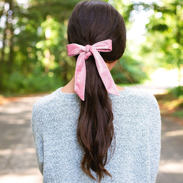 pink velvet bow scrunchie in brunette ponytail