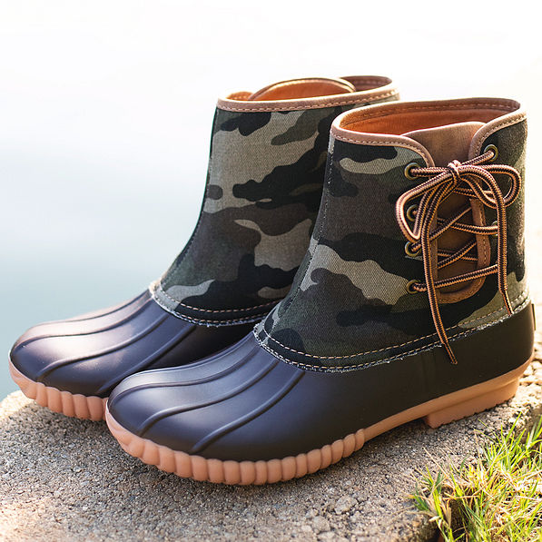 camo pull on duck boots near pond