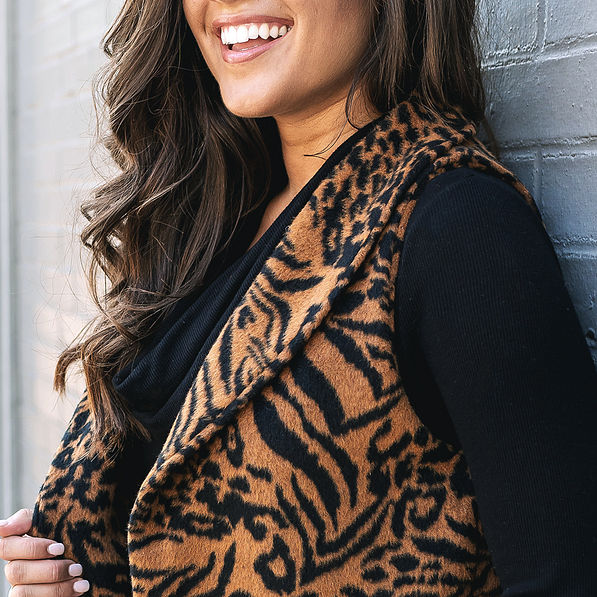 textured detail on tiger print fur vest