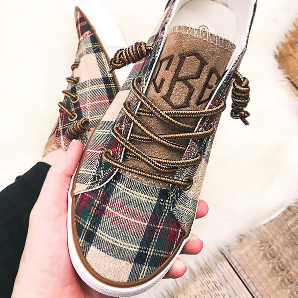 close up of plaid canvas sneakers with twirled laces