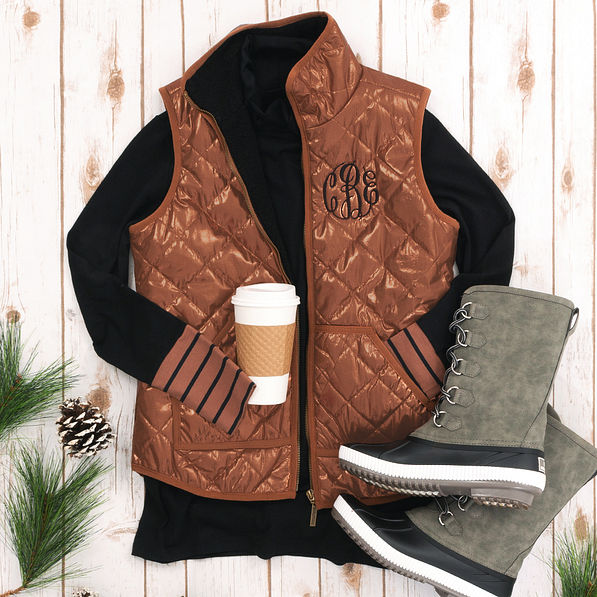 bronze monogrammed puffy vest with gray winter duck boots
