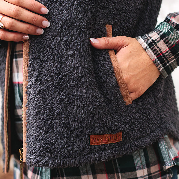 leather branding patch on monogrammed sherpa vest